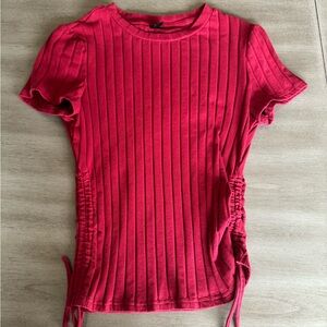 Bright red t-shirt, never worn. Size large, but fits like a medium.